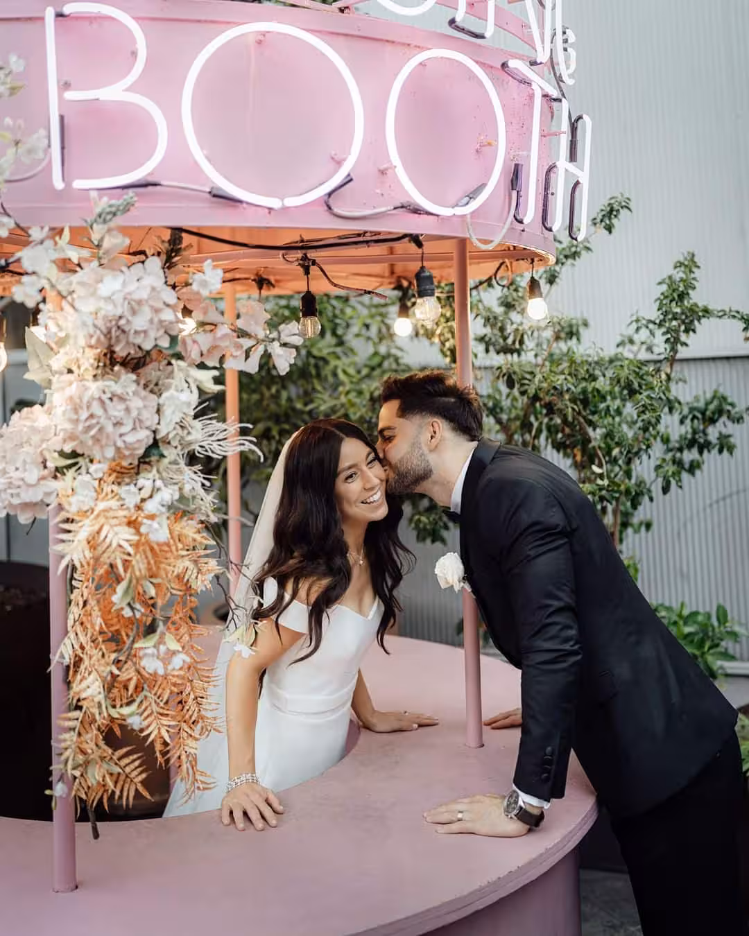 The Grounds Events | Wedding Couple at Kissing Booth