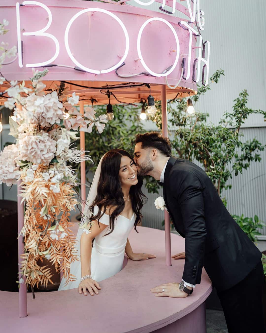 The Grounds Events | Wedding Couple at Kissing Booth