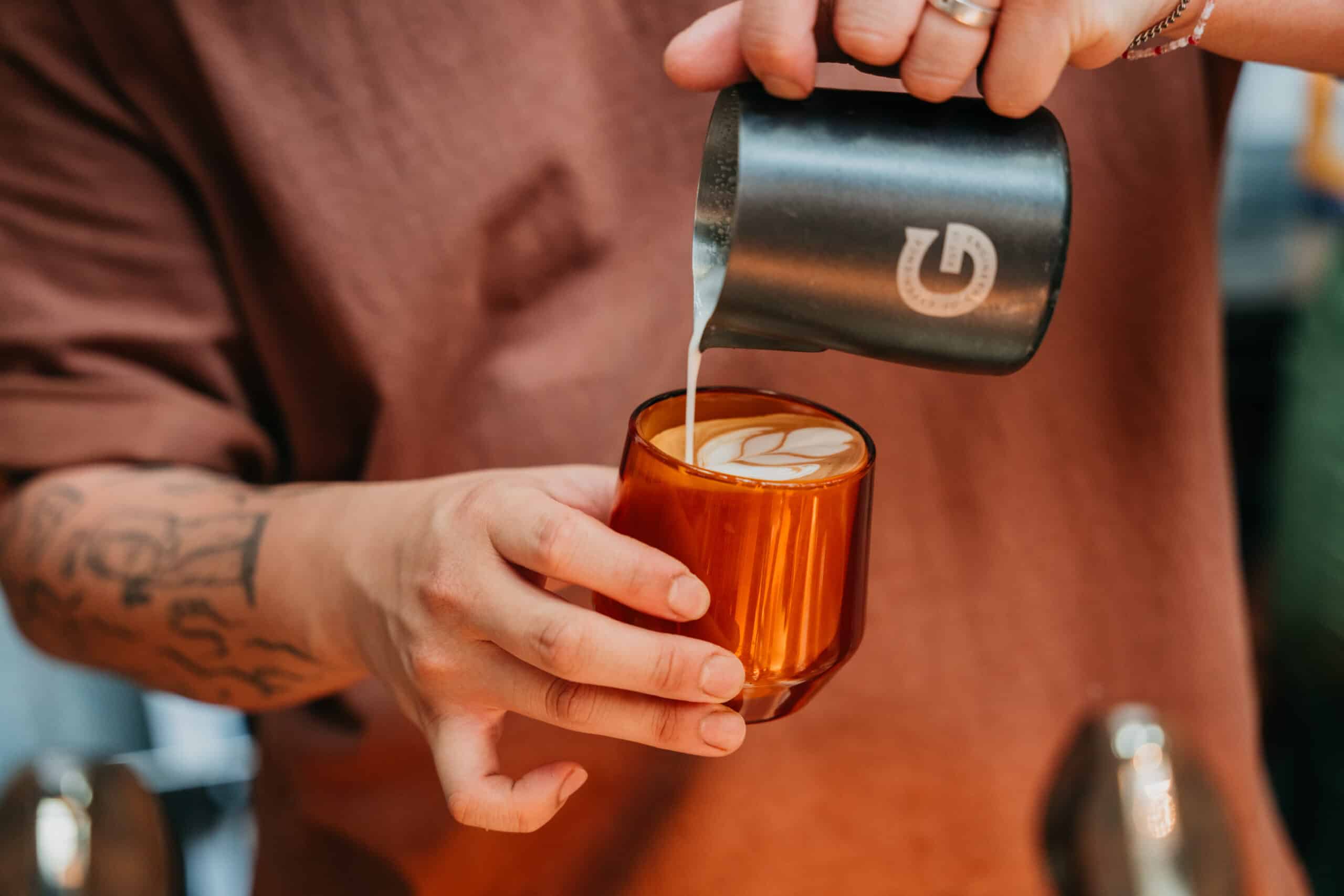 coffee factory latte being poured